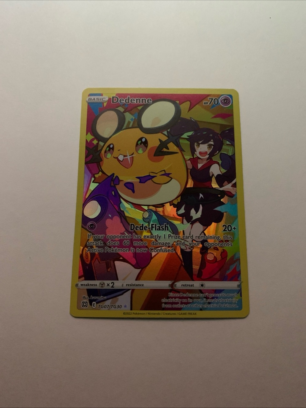 Pokemon Dedenne Yellow Holo Trading Card with Purple Accents